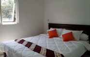 Kamar Tidur 4 Yustin Family Homestay