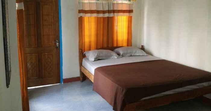 ห้องนอน OYO 93359 Kawi Homestay