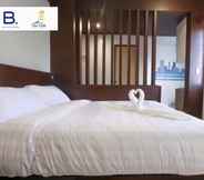 Phòng ngủ 4 Bed and Bath Serviced Suites