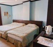 Kamar Tidur 4 Crowne Garden Hotel