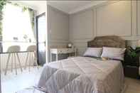 ห้องนอน Cozrum Homes - RiverGate Residence