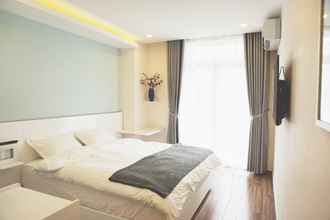 Kamar Tidur 4 Shinhua Hotel