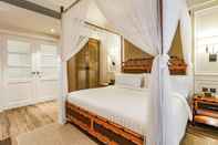Phòng ngủ Feliz Hotel Boracay Managed by Enderun Hotels