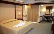 Bedroom 2 Grand Royal Plaza Hotel