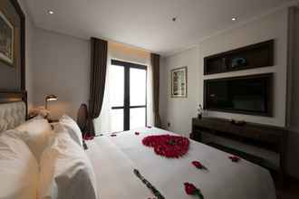 Kamar Tidur 4 The Q Hotel Hanoi