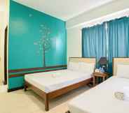 Bedroom 4 RedDoorz Plus near Rizal Junction