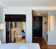 Kamar Tidur 6 The Wing Boutique Hotel