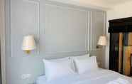 Kamar Tidur 5 The Wing Boutique Hotel