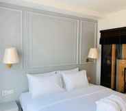 Kamar Tidur 5 The Wing Boutique Hotel