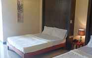 Kamar Tidur 4 Tomzen Beachfront Suites