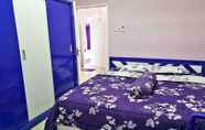 Kamar Tidur 5 Purple Lombok Guest House