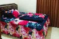 Bedroom Lestary Homestay - 3 Bedroom