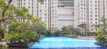 Swimming Pool 4 Cozy 2BR at Green Bay Apartment By Travelio
