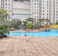 Swimming Pool 3 Cozy 2BR at Green Bay Apartment By Travelio