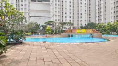Swimming Pool 4 Cozy 2BR at Green Bay Apartment By Travelio