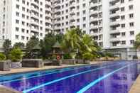 Swimming Pool Cozy and Spacious 3BR at Poins Square Apartment By Travelio