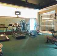 Fitness Center 4 Cozy and Spacious 3BR at Poins Square Apartment By Travelio