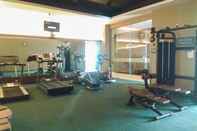 Fitness Center Cozy and Spacious 3BR at Poins Square Apartment By Travelio