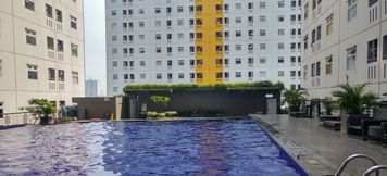 Swimming Pool 2 Good Living at 2BR Green Pramuka City Apartment By Travelio
