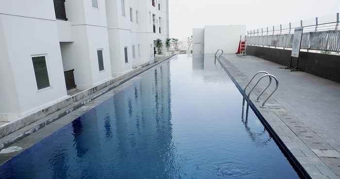 Swimming Pool Comfy and Best Price 2BR Apartment at Northland Ancol Residence By Travelio