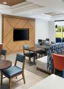 Hotel Lobby & Breakfast Seating Area Holiday Inn Express & Suites PORT ST. LUCIE WEST, an IHG Hotel