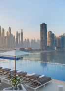 Take a dip in our rooftop pool and enjoy the skyline views voco Dubai the Palm, an IHG Hotel