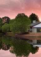 Hotel Exterior with Lake View Crowne Plaza ATLANTA SW - PEACHTREE CITY, an IHG Hotel