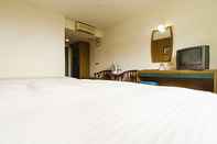 Bilik Tidur East Sun Spa Garden Hotel