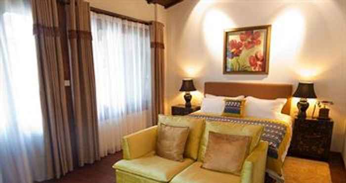 Kamar Tidur Red Wall Garden Hotel