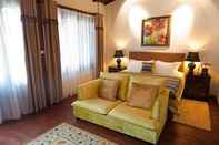 Kamar Tidur Red Wall Garden Hotel