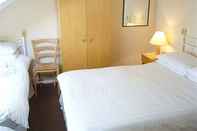 ห้องนอน Cumbria House Hotel