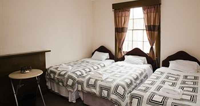 Kamar Tidur Andrews House Hotel