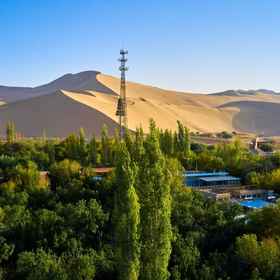 Hotel Exterior1Dunhuang Jiuju Inn,敦煌国际饭店-停车场飯店