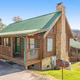 Hotel Exterior 1 Arrowhead Log Cabin Resort - Cuddly Bear Hideaway Cabin, Hotel Pigeon Forge
