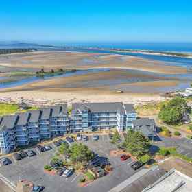 Logo 1 Bay Front Access and Cozy Comfort - Charming Coastal Getaway, Connie Hansen Garden Hotels