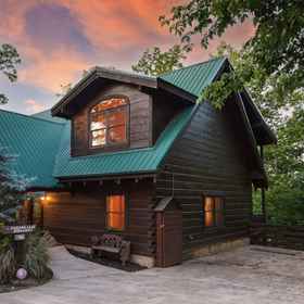 Hotel Exterior 1 Falling Leaf Hideaway – Alpine Mountain Village Cabin with Hot Tub, Theater, Game Room, Pools!, The Island in Pigeon Forge Hotels