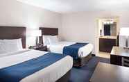 Kamar Tidur 5 Econo Lodge & Suites Resort