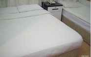 Kamar Tidur 4 Wing Sing Hotel