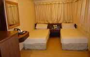 Kamar Tidur 5 Wing Sing Hotel