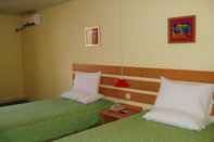 Phòng ngủ Home Inn Quanan Square