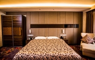 Bedroom 4 Ruyi Business Hotel Beijing