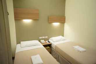 Kamar Tidur 4 The Center Suites