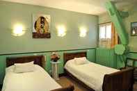 ห้องนอน Logis Hotellerie du Cheval Blanc