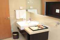 Phòng tắm bên trong Thumb Plaza Apartel Qingdao Sunland