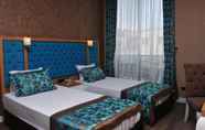 Bedroom 2 Niss Business  Hotel