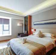Bedroom 2 Yihe Glory Hotel