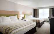 Kamar Tidur 7 Country Inn & Suites by Radisson, Camp Springs, MD