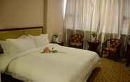 Bedroom 4 E E Business Hotel