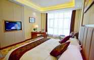 Bedroom 2 Ramada Plaza by Wyndham Changsha East