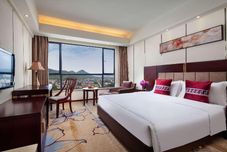 침실 Ramada by Wyndham Liuzhou Luzhai